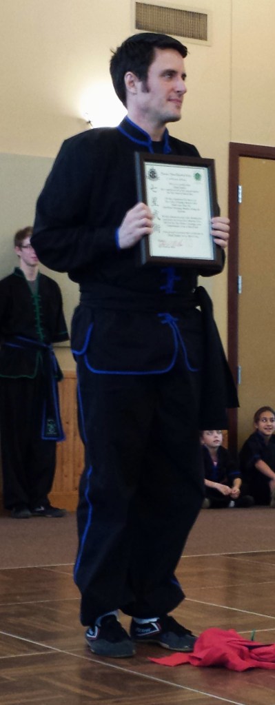 Chad Fenner recieving a black belt in Kung Fu